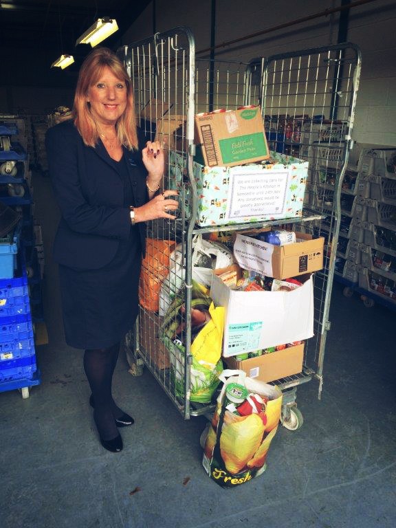 Verena Harrigan with some of the cans donated.